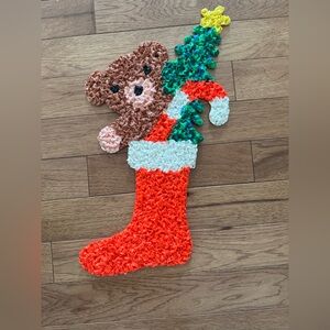 Vintage melted plastic  teddy bear in a stocking